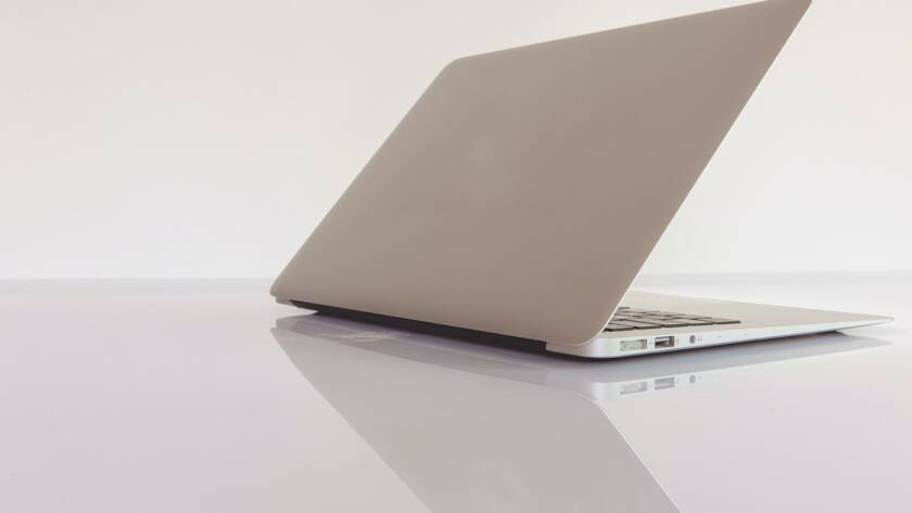 macbook air on white table